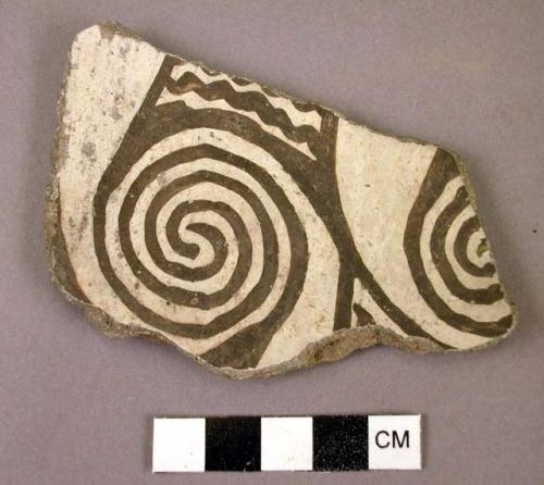 Ceramic body sherd, black on white, spiral design