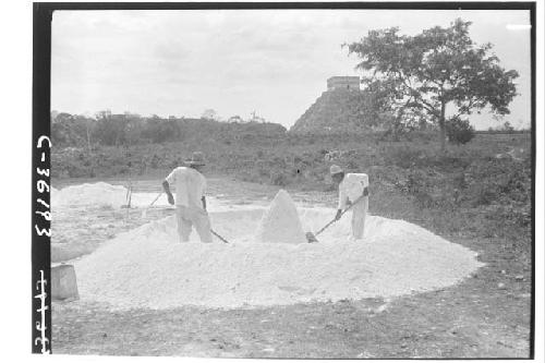 Structure 3 E 3. Workmen mixing mortar