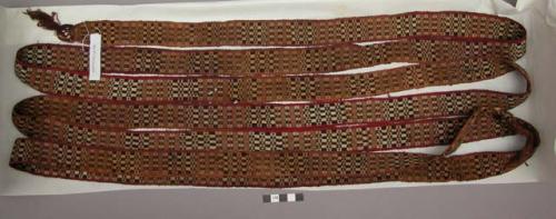 Organic, woven fiber, belt, black, brown, tan checked pattern, red edging