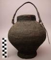 Basket, no lid, round body tapered to flared base, straight rim, braided handle