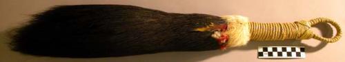 Feather whisk (?) (sue' lare') - black-brown, red, yellow, green feathers; white