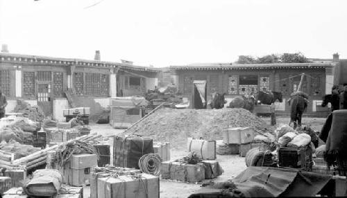 Ponies and boxes outside building