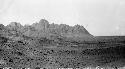 Desert landscape, with mountains in the background