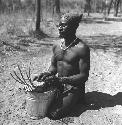 Bela playing a //guashi on a tin bucket