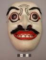 Carved and painted wooden mask with shell inlay as teeth and fur for +
