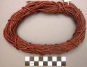 Red braided woman's belt ("kebuss")