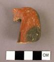 Pipe? fragment with effigy head? (black on red)