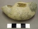 Stone, ground stone fragment, possible weight, curved, broken both ends