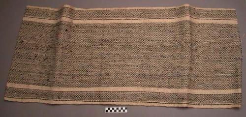 Long section of white ramie cloth with woven diamond design in black