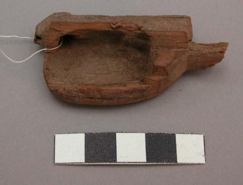 Organic, wood, tool, carved cup shape, perforated, rounded, smooth on one side