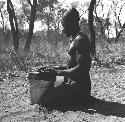 Bela playing a //guashi on a tin bucket