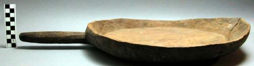 Carved; wooden "scoop" with handle, used for food, carved by men.