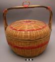 Plaited bamboo baskets and covers, with painted red band around the +