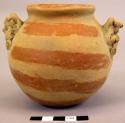 Pottery jar, human figure (?) on sides