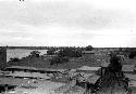 Scene of town looking over roofs toward river