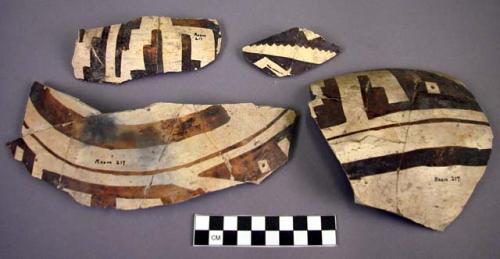 Fragments of jeddito black on orange pottery jar