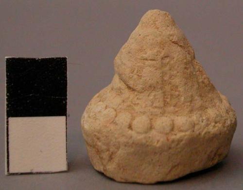 Tsats of clay, votive simplification of dagoba.