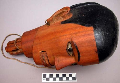 Wooden head of a mechanical woman - always made for one who has died +