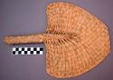 Fan, woven palm fiber, triangular blade, straight edged tip, woven handle