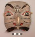 Carved and painted wooden mask - clown's mask used in the topeng and +