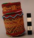Small veritod basketry box woven with threads and beads