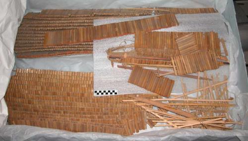 Bamboo pieces; part of house model.