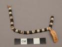 String beads strundg on cord of cocanut fibre
