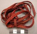 Red woven man's belt ("dau"). Made by women.