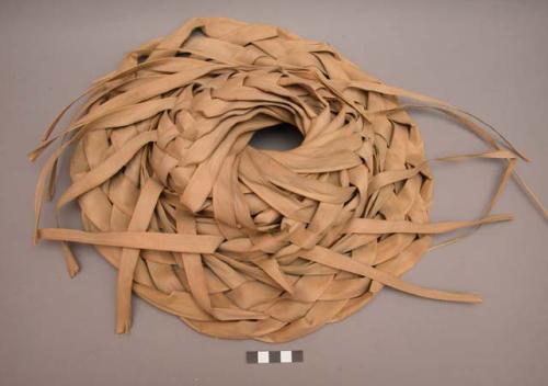Shallow hats made from plaited palm fiber, collected in 1940, +