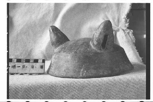 Fragmentary tripodal pottery bowl.