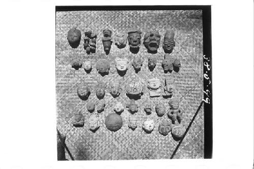 Thirty-one Figurine Heads; Three Whole Figurines; Eight to Ten Jadite Beads