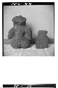 Back side of two stone figures