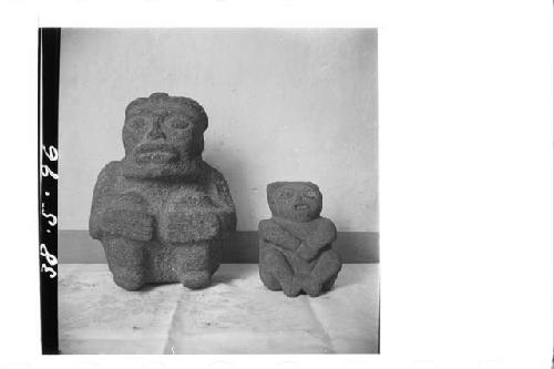 Front of two stone figures
