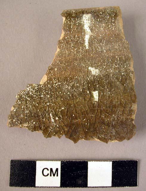 Rim potsherd - green-brown glaze