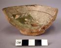 Pottery bowl fragment - green-brown glaze