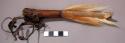Whistle, tubular piece of wood, end decorated with tail of Impallo Antelope (nsa