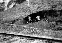 Men working beside railroad tracks