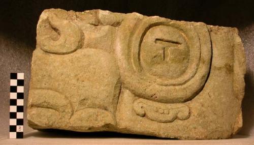 Fragment of large grotesque face (glyph)