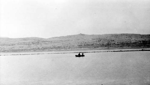 People on boat in lake