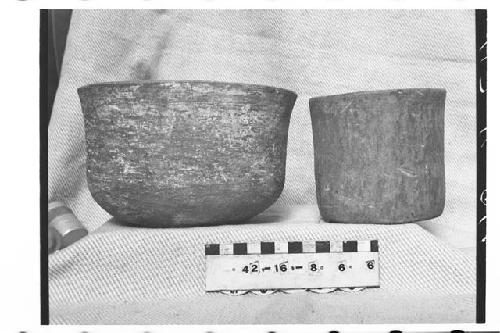 Two Pottery Vessels; Plaster Painted