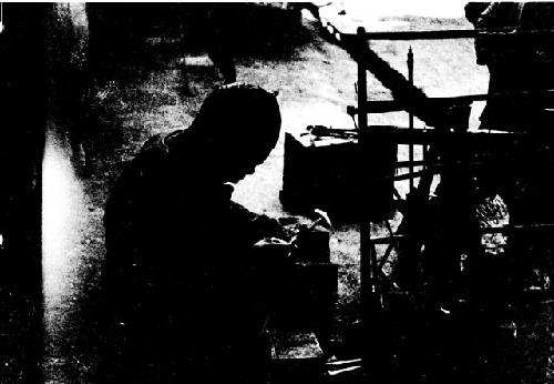 Chinese man mending pottery