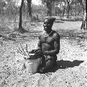 Bela playing a //guashi on a tin bucket