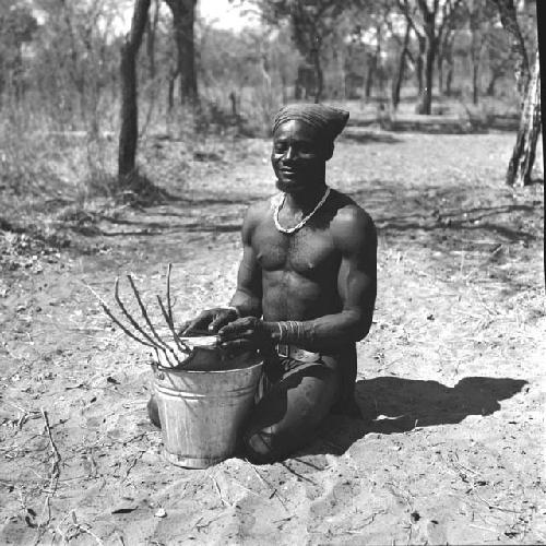 Bela playing a //guashi on a tin bucket