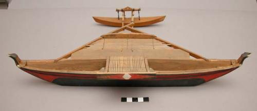Wooden model of a canoe without rigging - painted black, red & white +