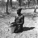 Bela playing a //guashi on a tin bucket