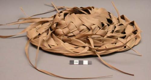 Shallow hats made from plaited palm fiber, collected in 1940, Modern manufacture