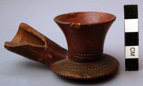 Red clay pipe bowls of non-indian manufacture