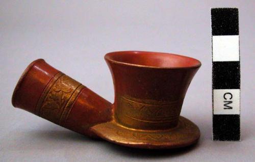 Pipe, moulded ceramic bowl, red with gold painted designs