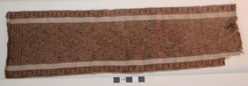 Organic, woven fiber textile, brown, white, interlocking bird motif, scroll