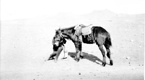 Person pushing pony